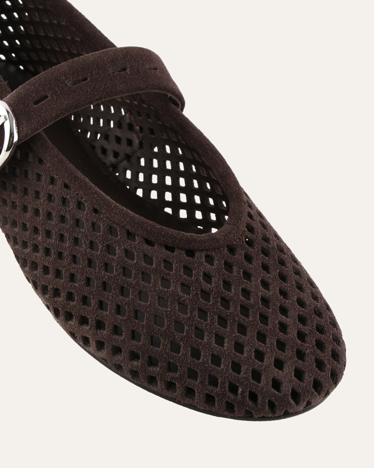 Brown suede ballet flat shoe on a white background