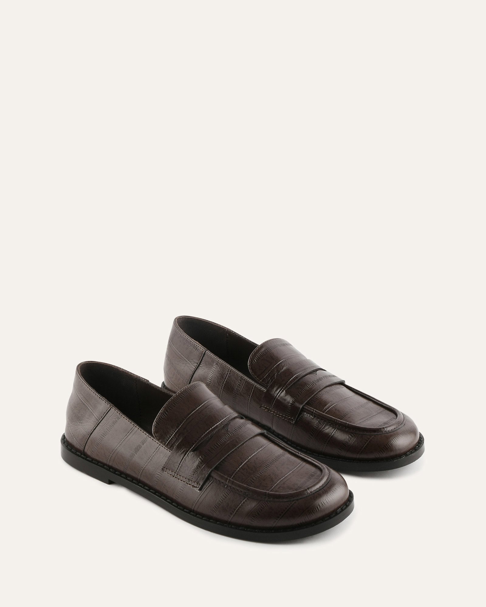Beige loafer with a buckle on a white background