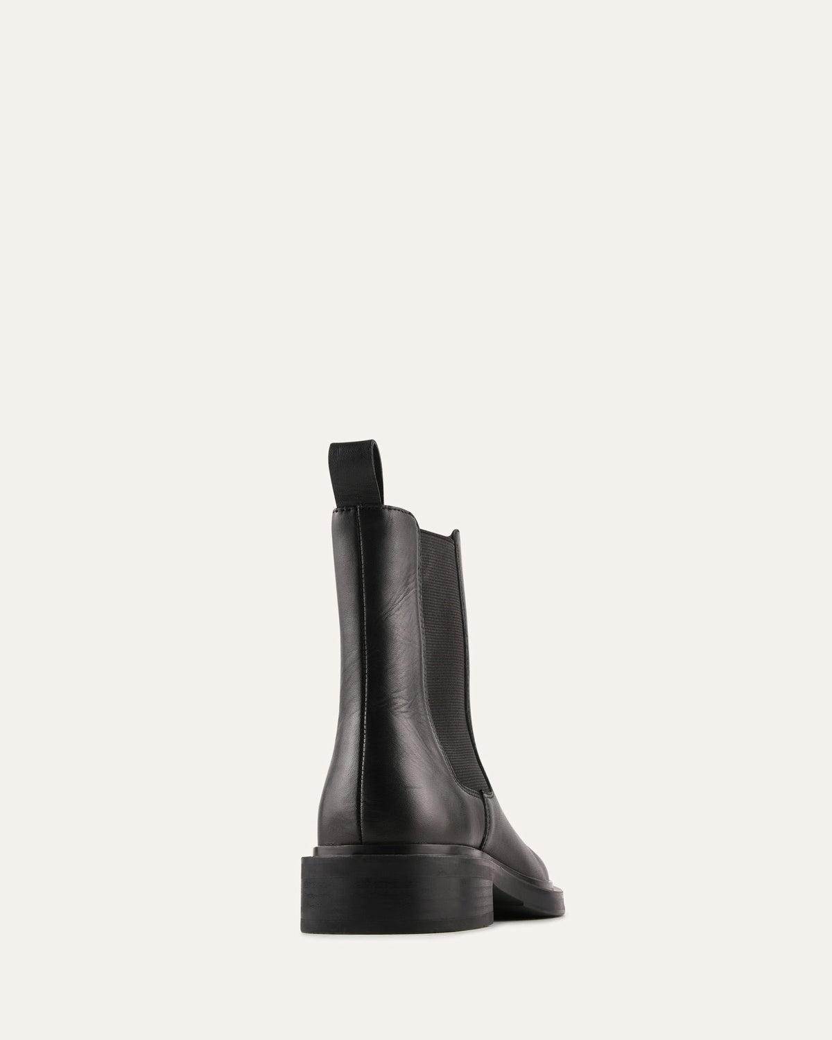Black leather ankle boots on a white background