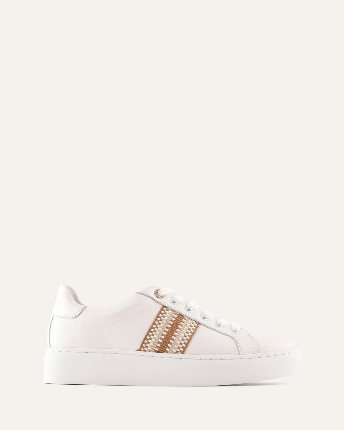 White sneaker with brown pattern on a light gray background