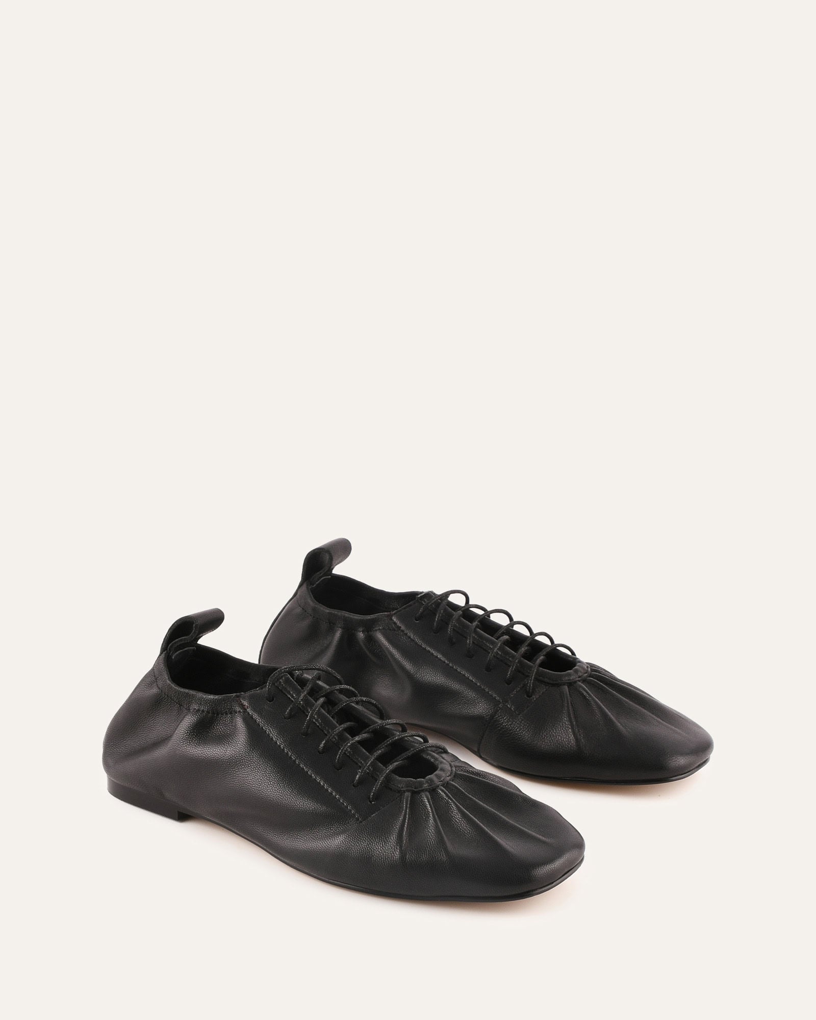 Black leather shoe on a white background