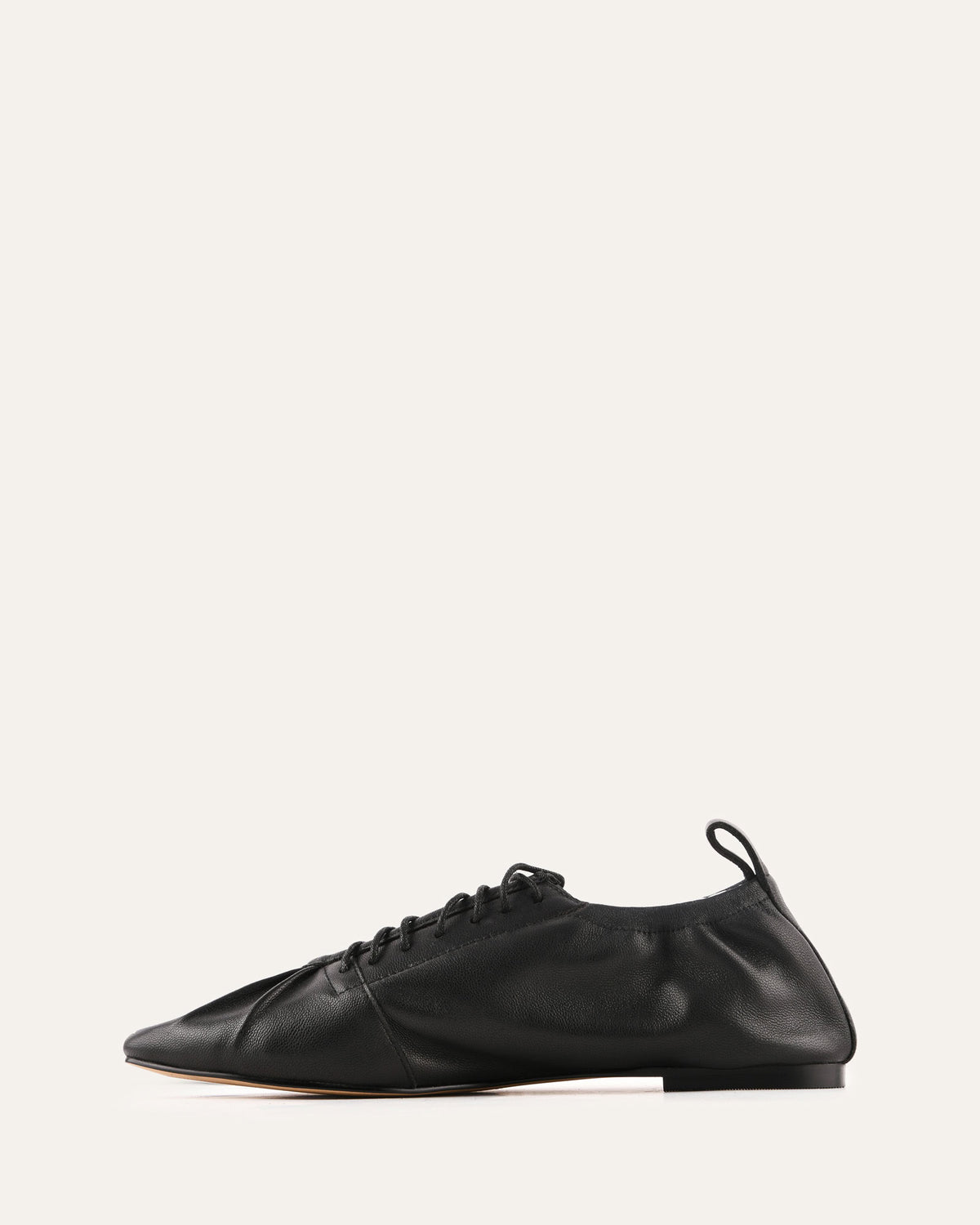 Black leather shoe on a white background