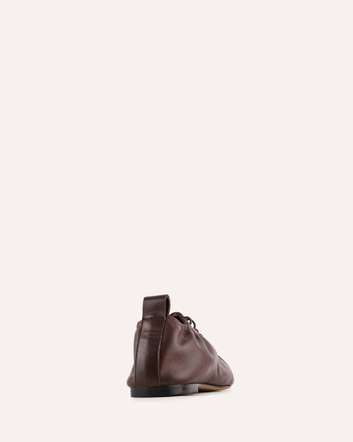 Brown leather shoe on a white background