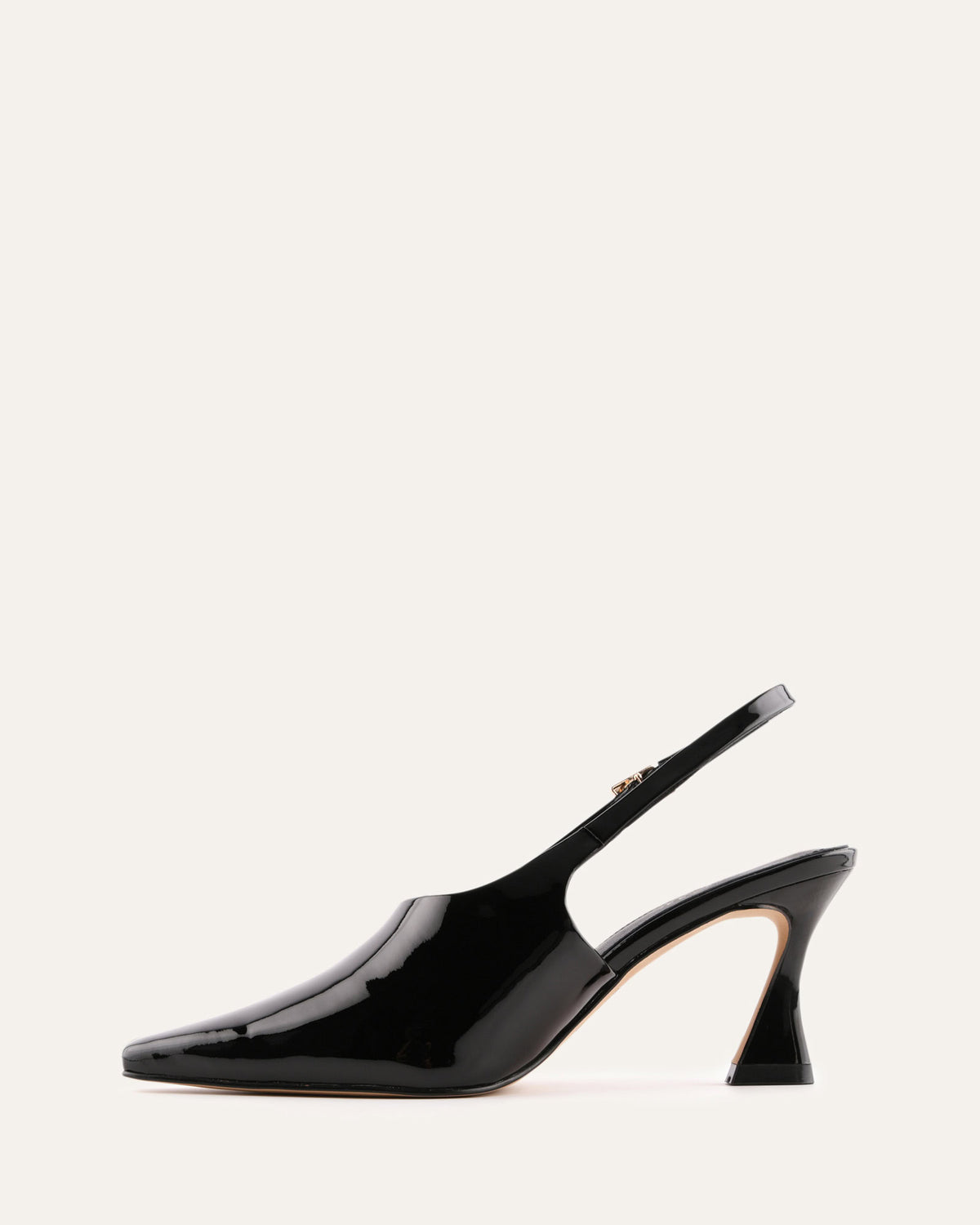 Black high-heeled slingback shoe on a white background