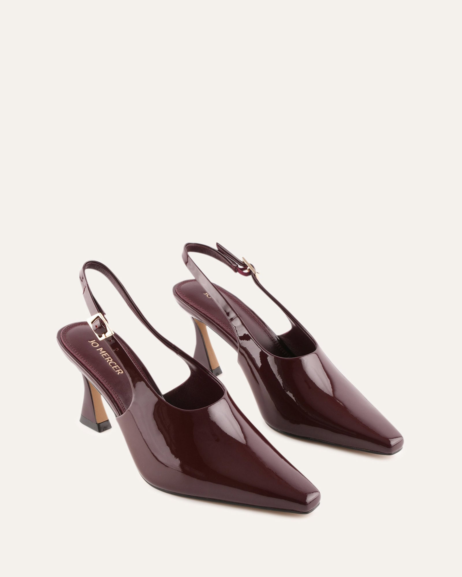 Burgundy high-heeled shoe on a white background