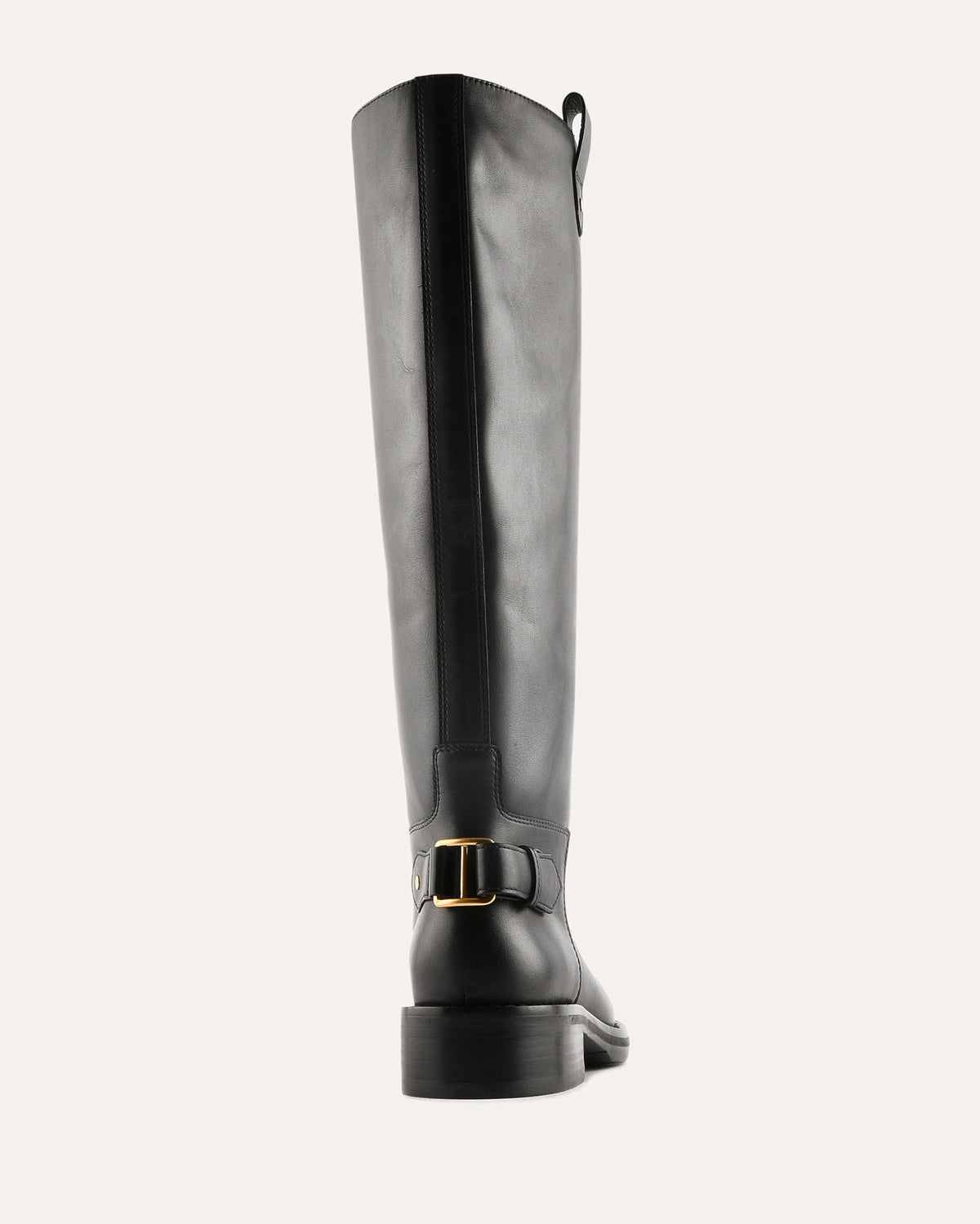 Black knee-high boot with a gold buckle on a white background