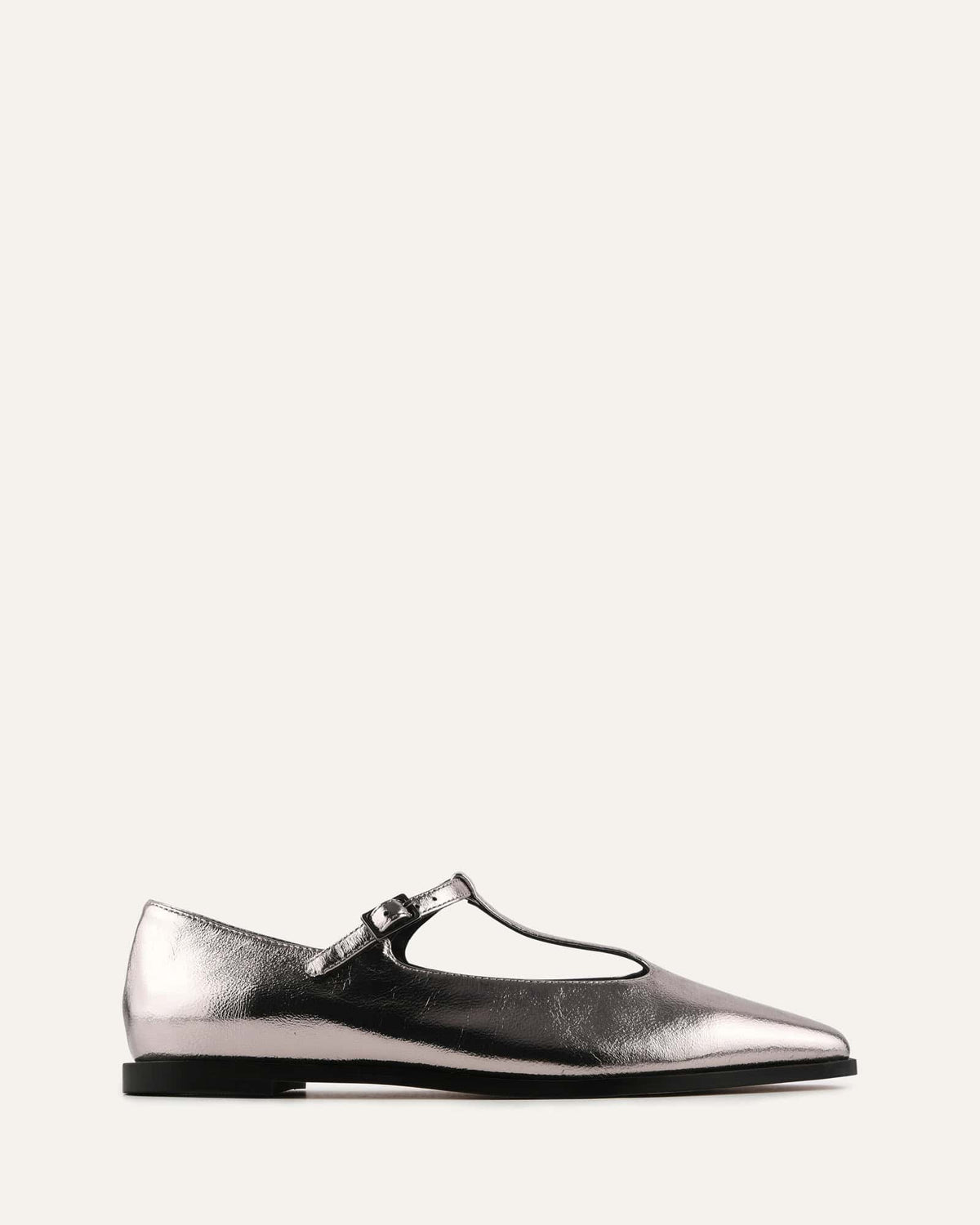 Silver metallic flat shoe with a strap on a white background