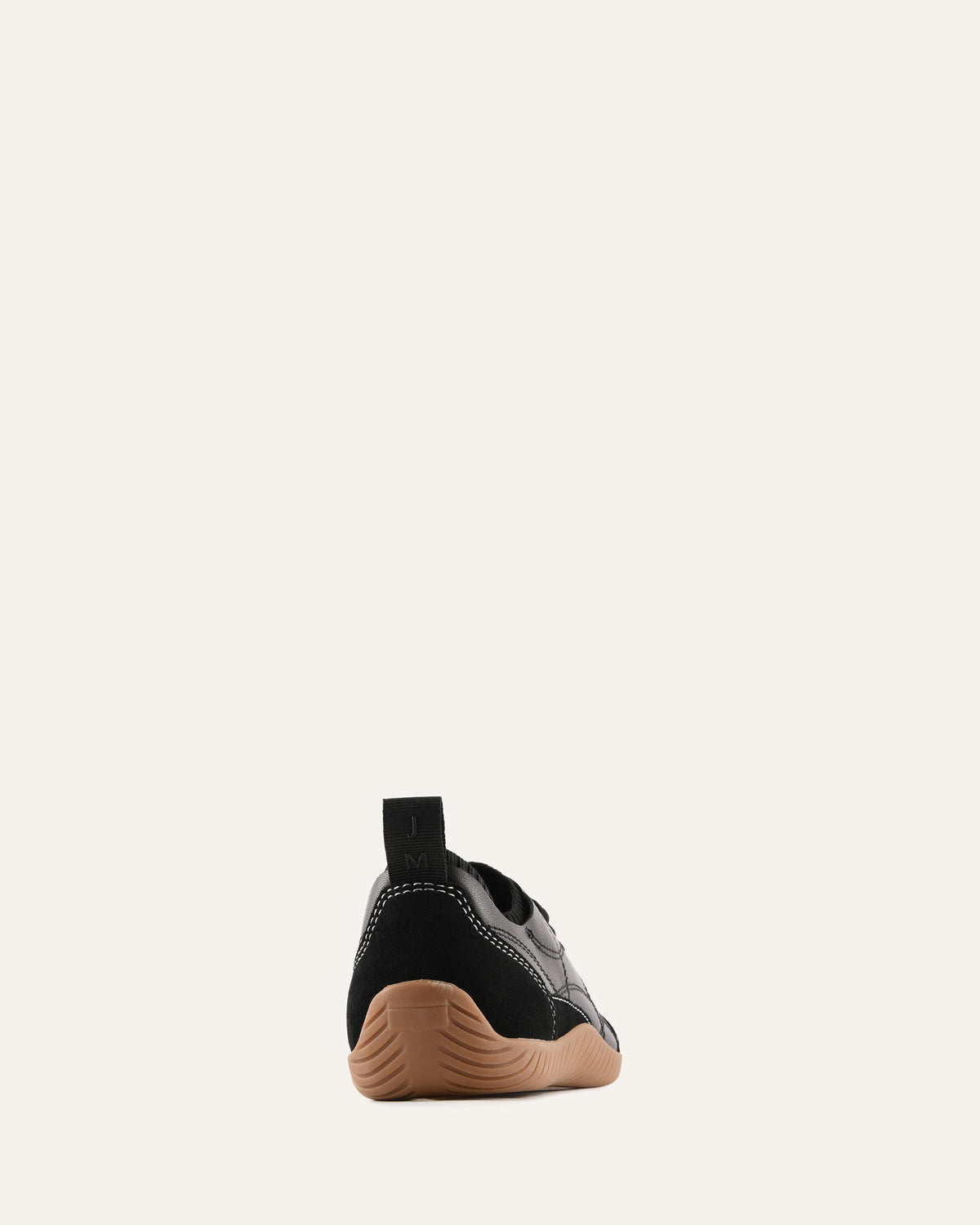 Black and brown shoe on a white background