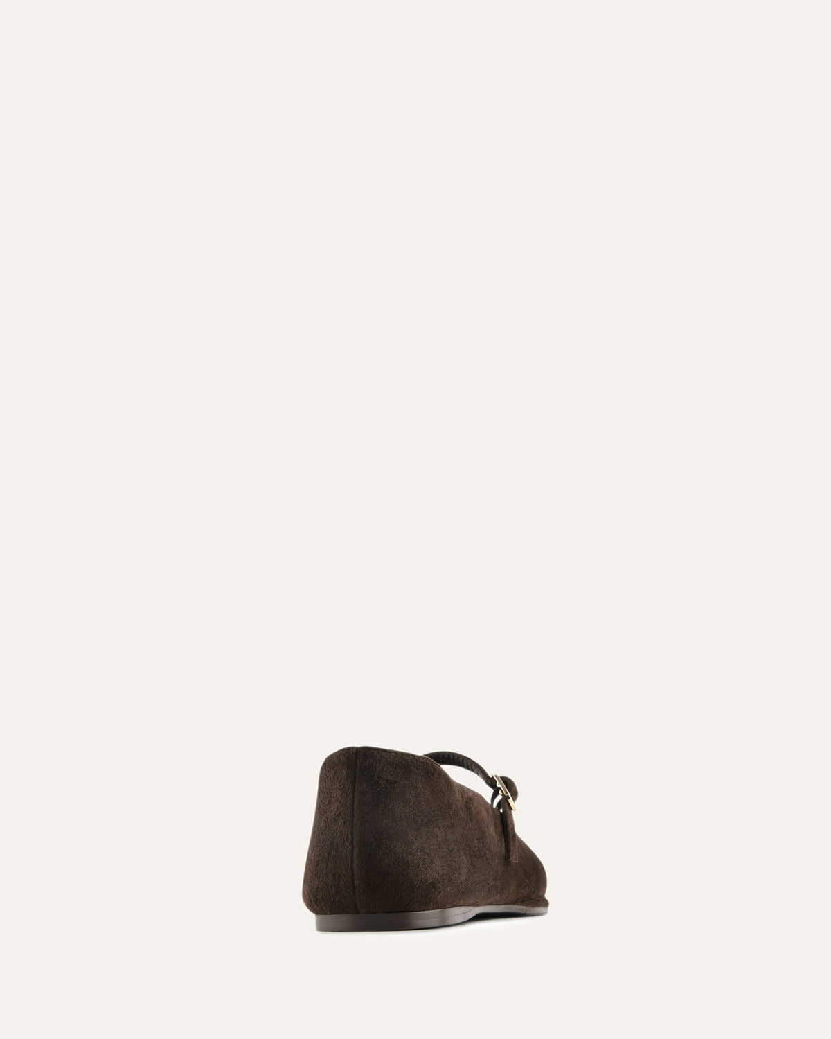 Brown suede shoe on a light gray background