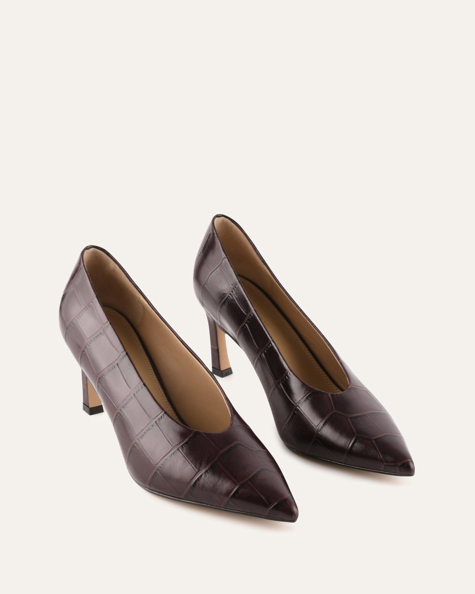 Brown high-heeled shoe on a white background