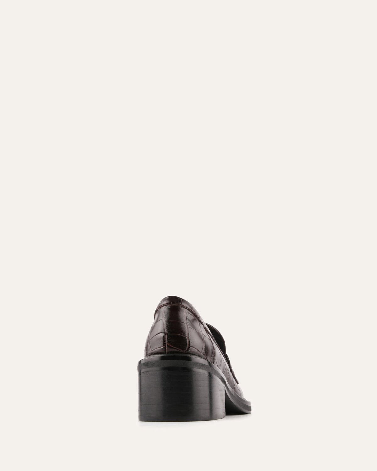 Brown leather shoe on a light gray background