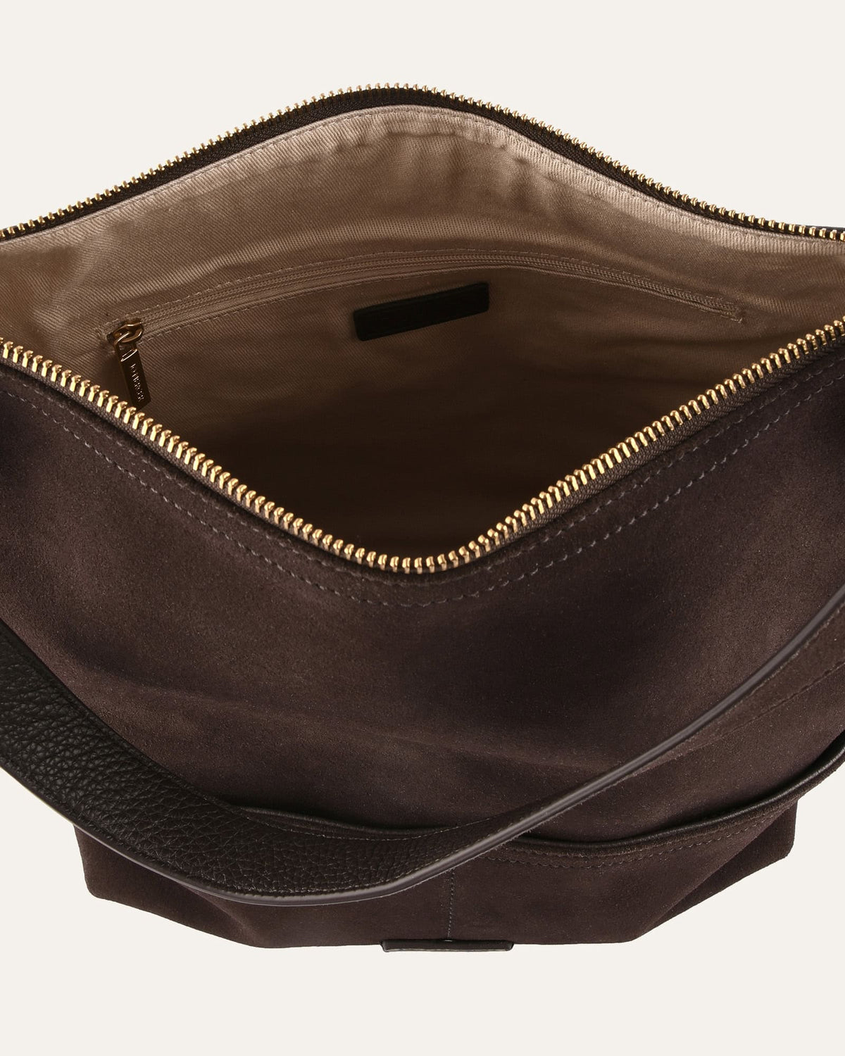 Brown leather bag with gold zipper on a white background