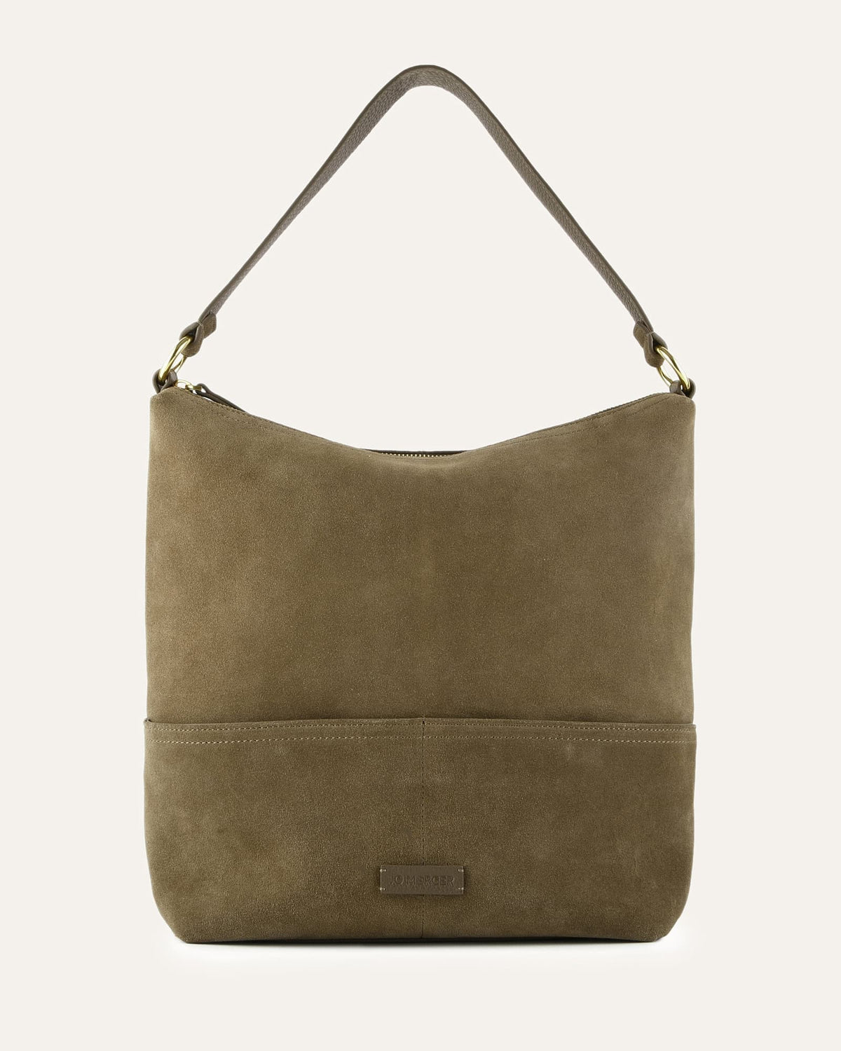 green suede handbag on a light beige background
