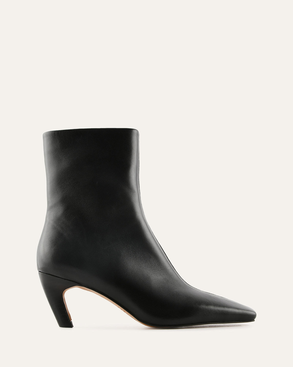 Black ankle boot on a light gray background