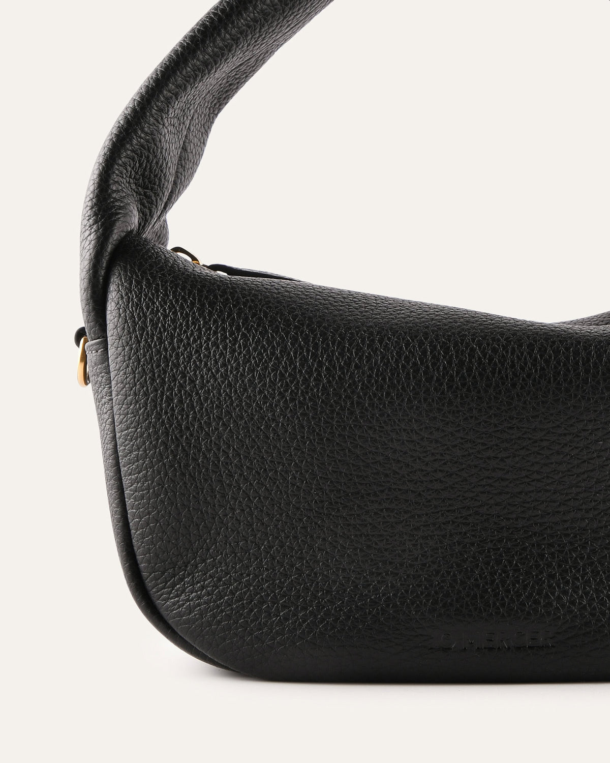 Black leather handbag on a white background