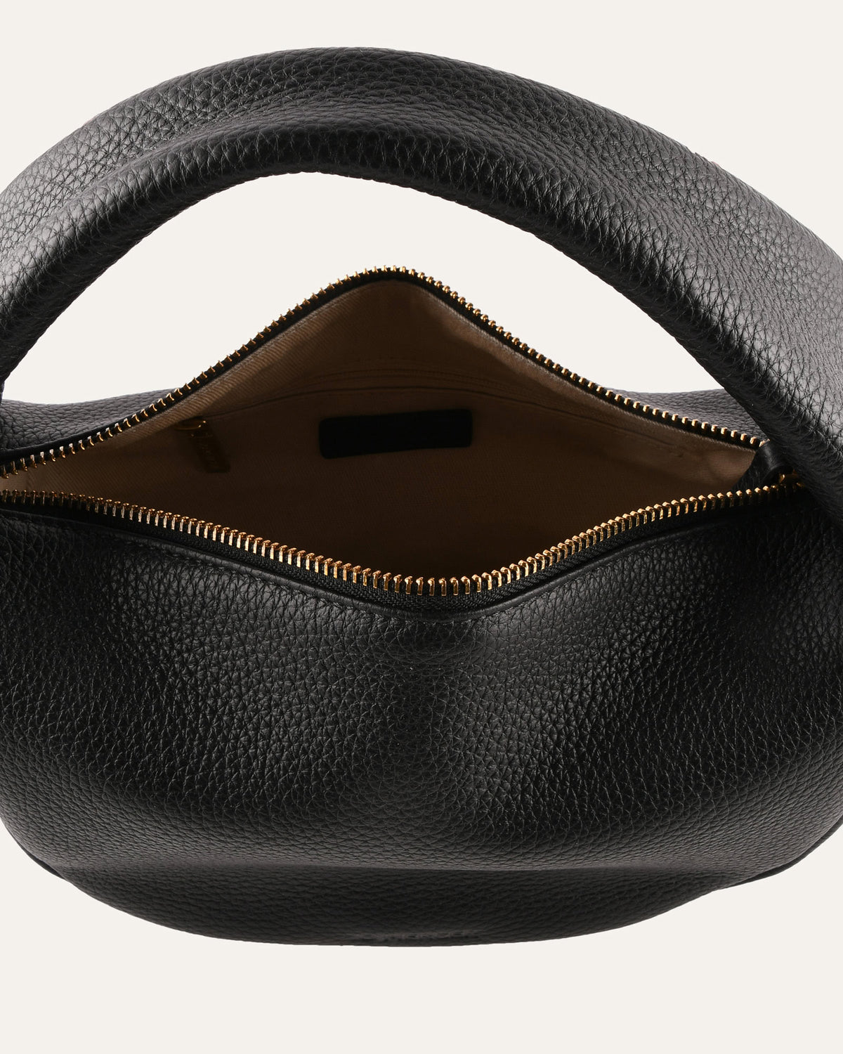 Black leather handbag with a zipper on a white background