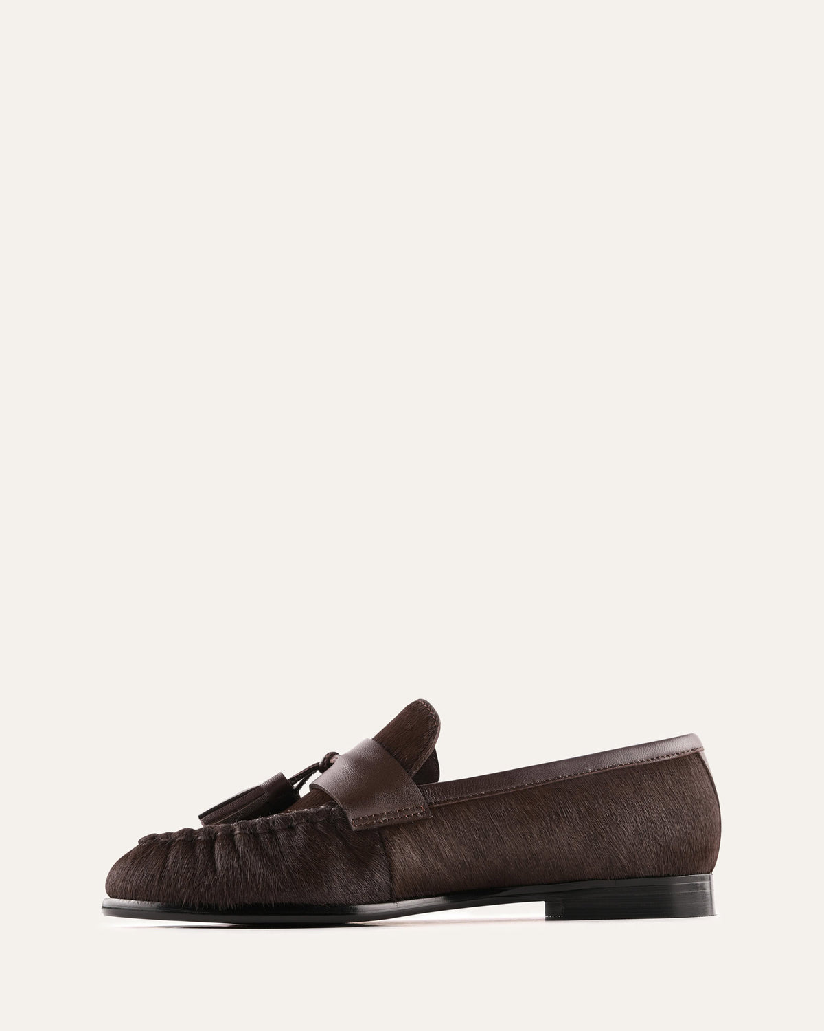 Brown loafer shoe on a white background