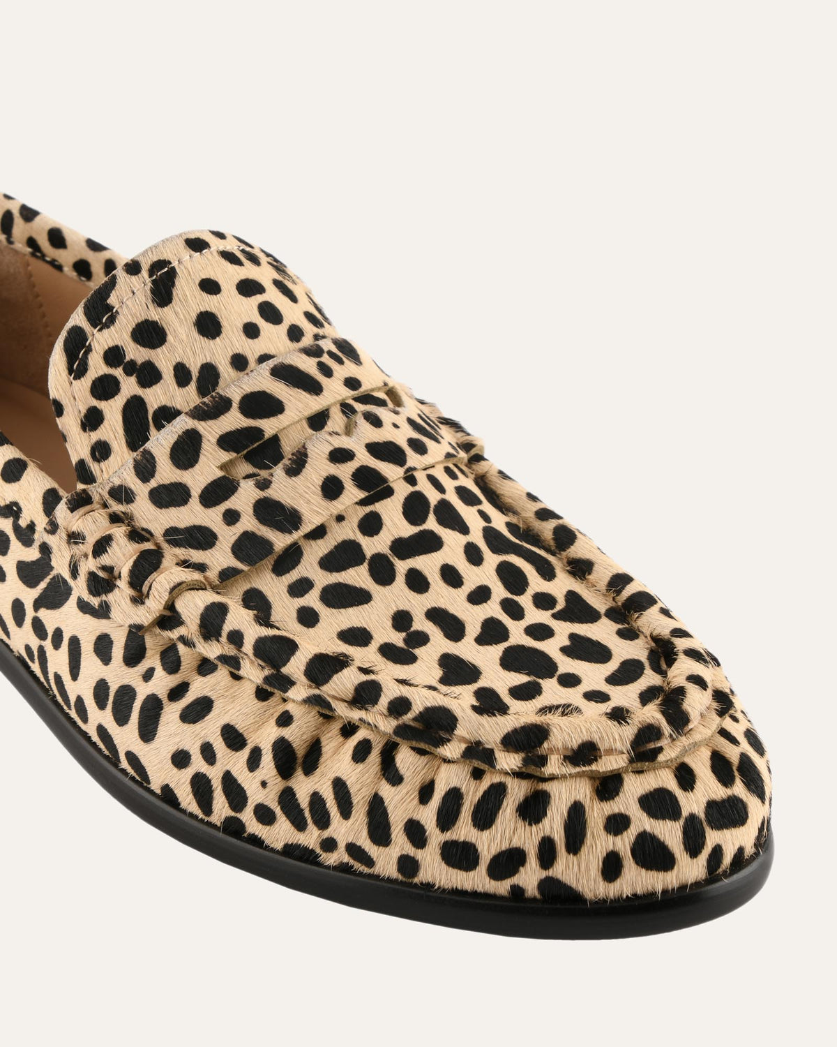 Leopard print loafer shoe on a white background