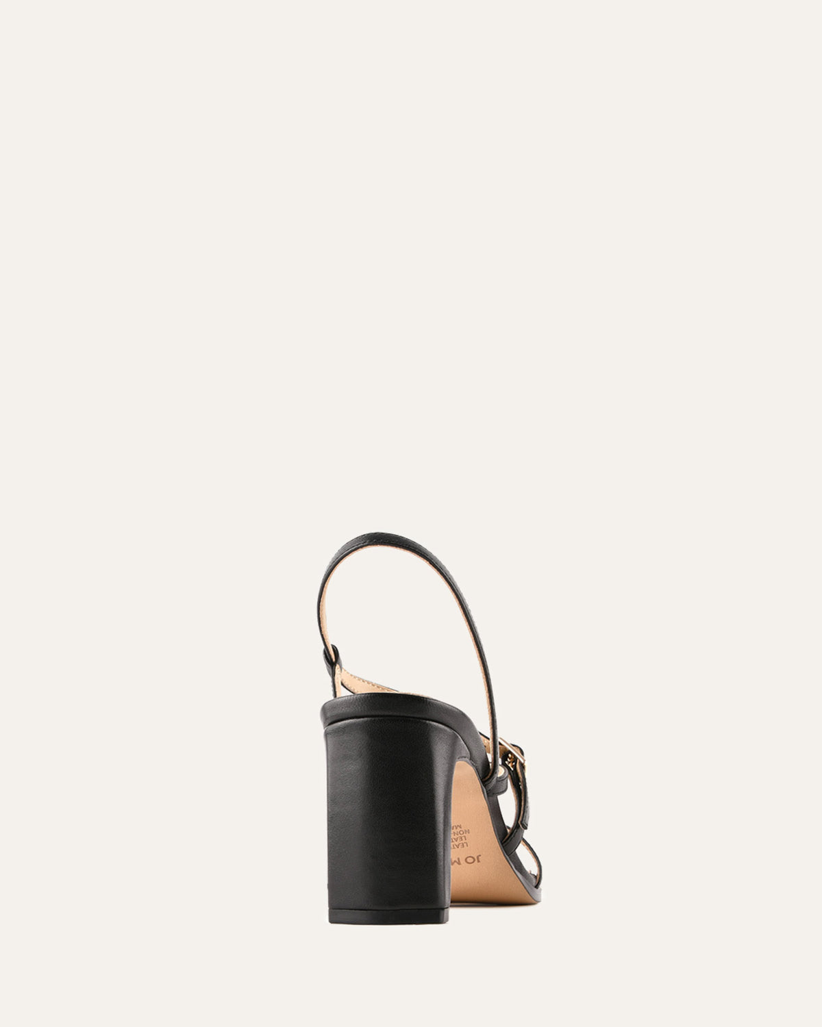 Black leather handbag with tan interior on a white background