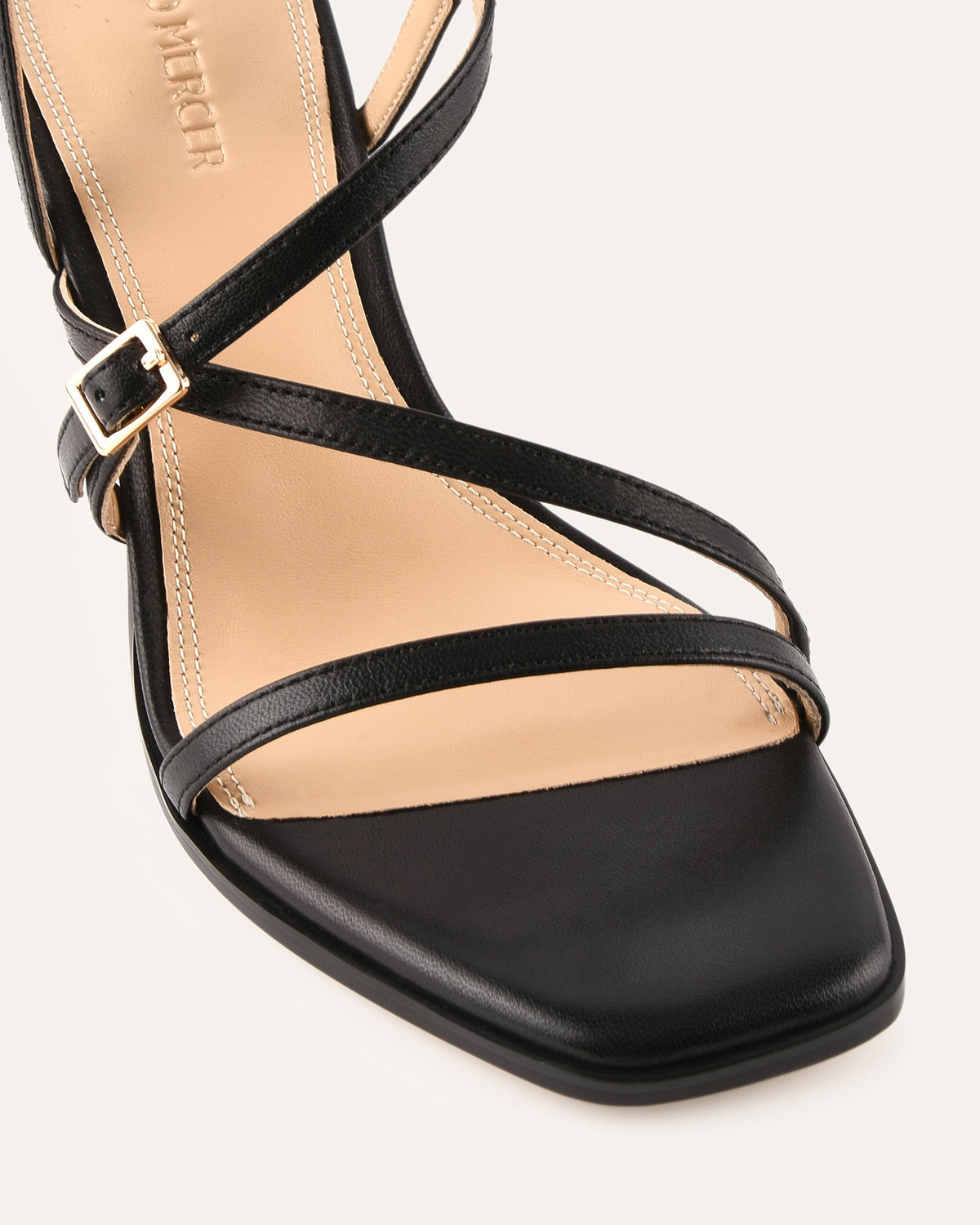 Black strappy sandal on a white background