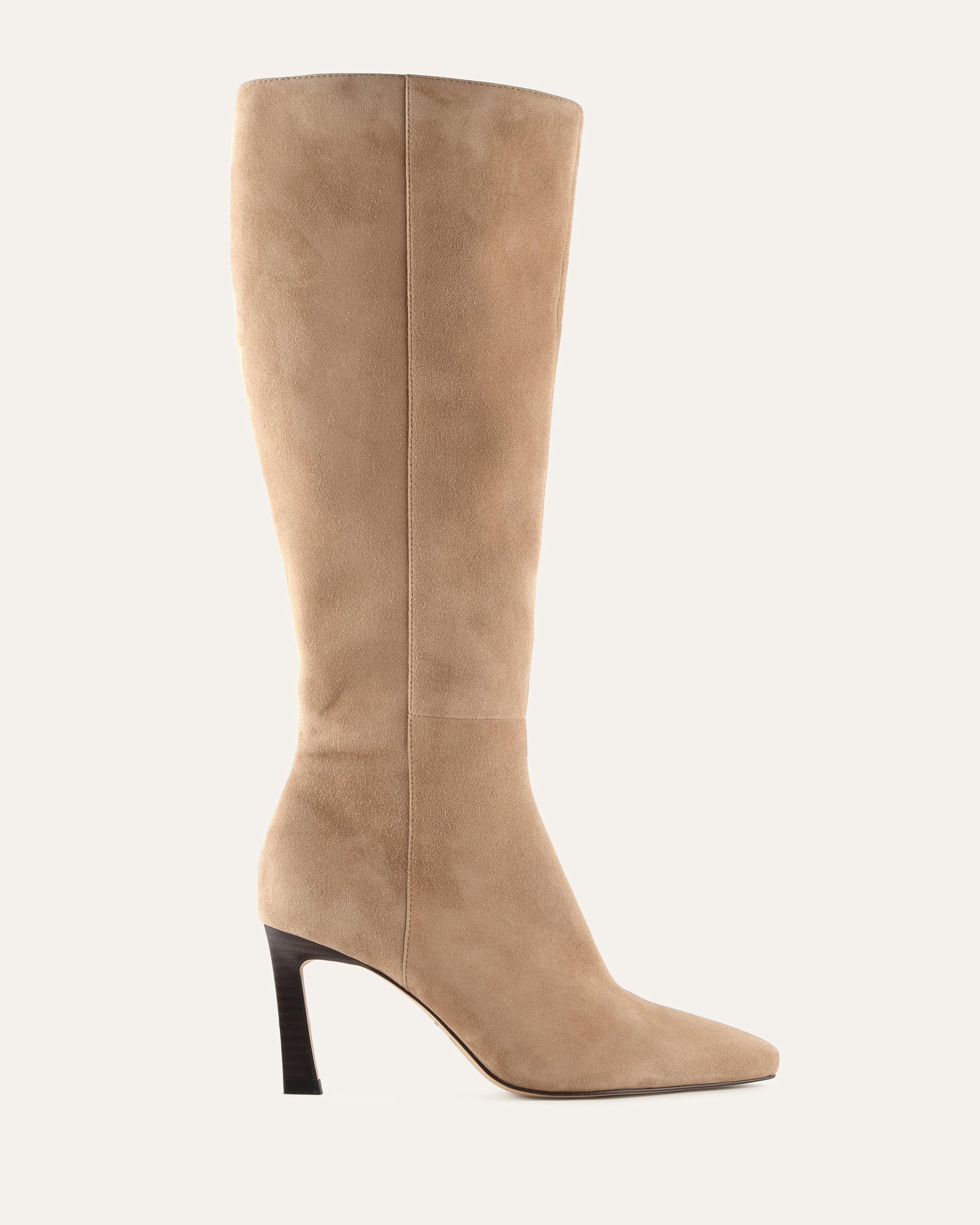Beige knee-high boot with a black heel on a white background