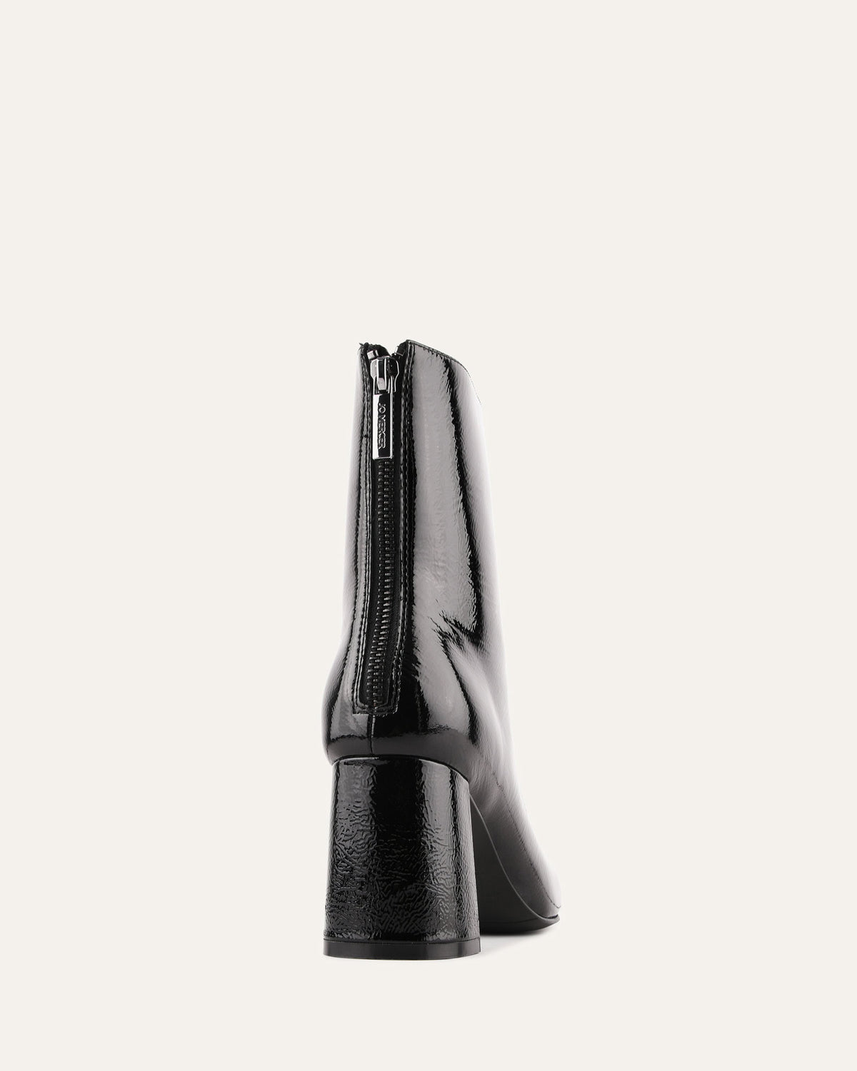 Black high-heeled boot with a zipper on a white background