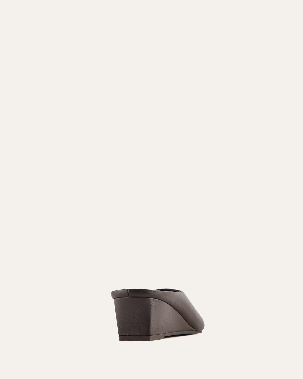 Dark brown shoe on a light gray background