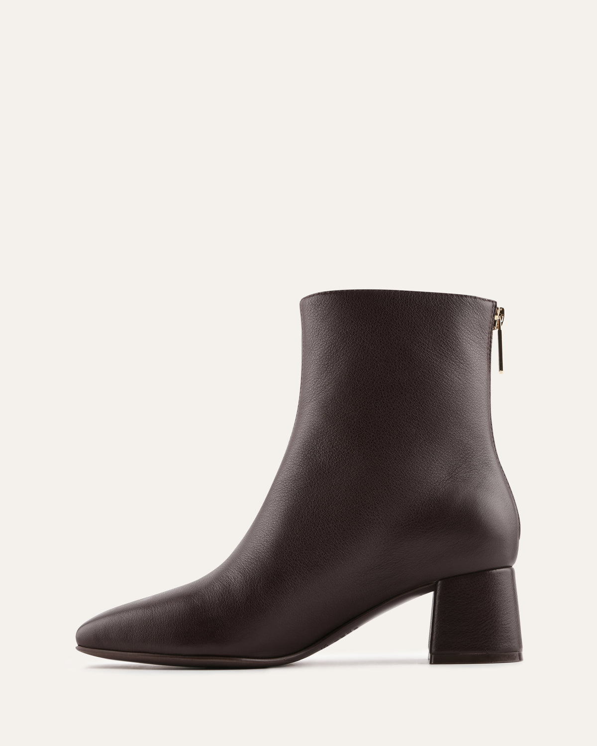 Black ankle boot on a light gray background