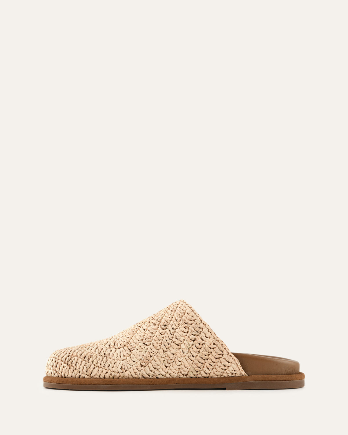 Beige slipper with textured surface on a white background