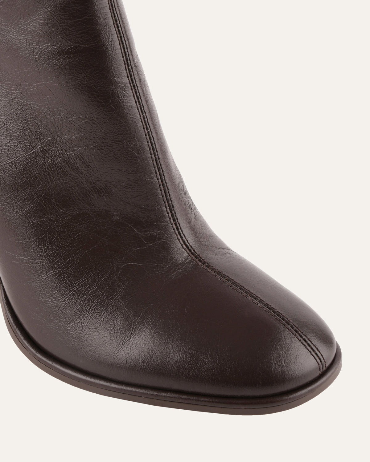 Brown leather boot on a white background