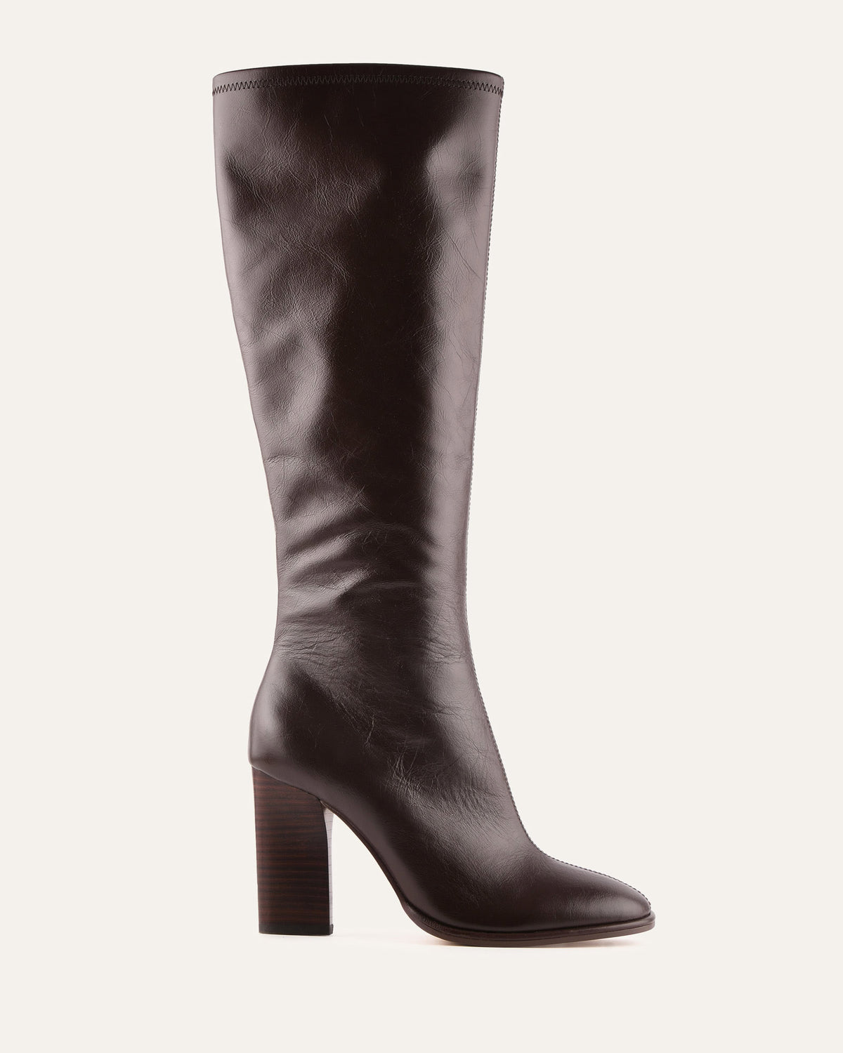 Brown knee-high boot on a light gray background