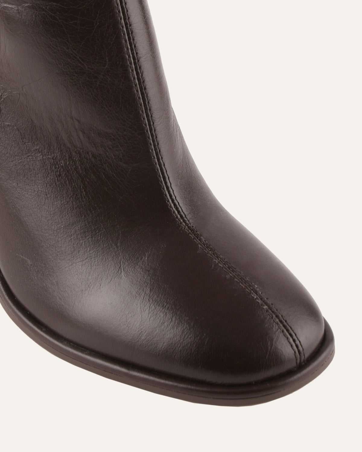 Brown leather boot on a white background