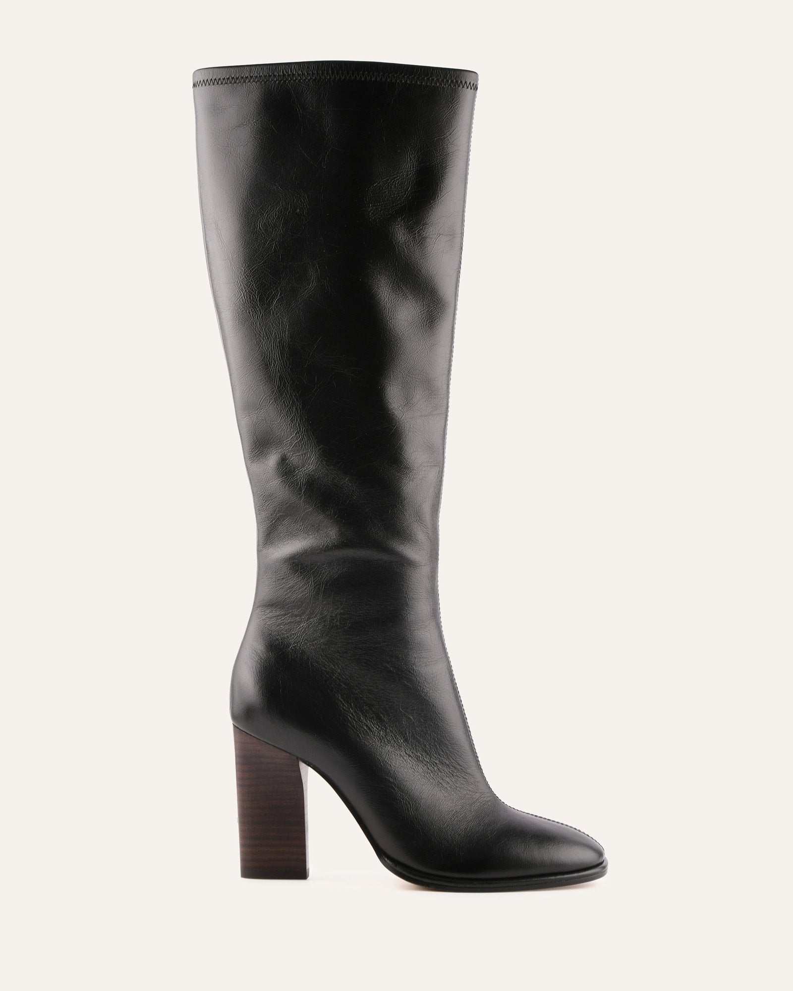 Black knee-high boot on a white background