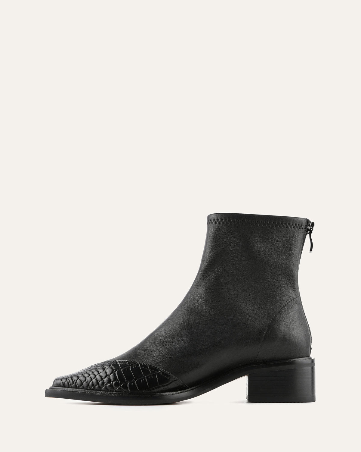 Black leather ankle boot with woven pattern on a white background
