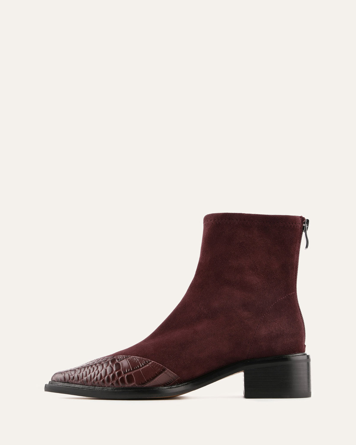 Maroon ankle boot with a textured toe on a white background