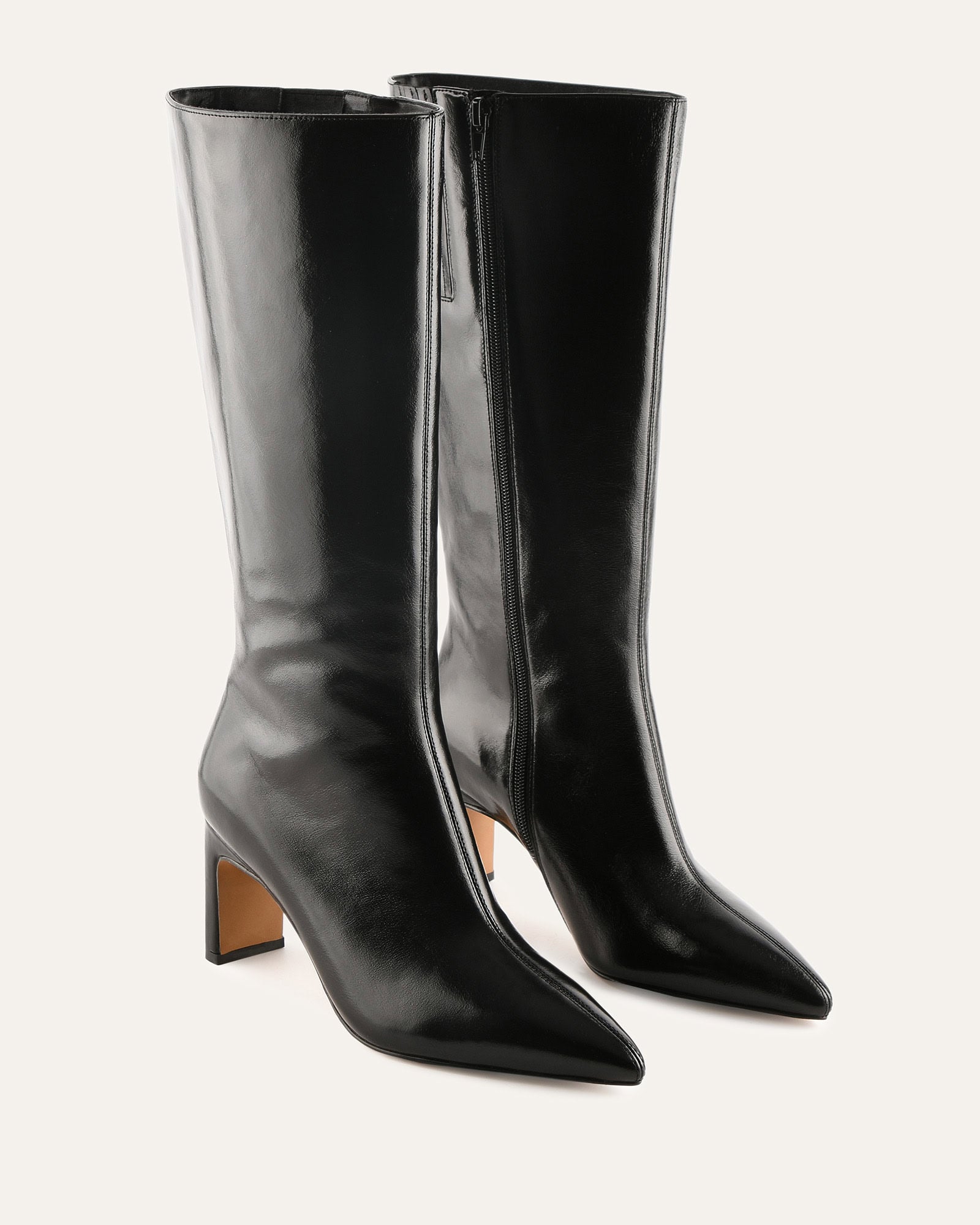 Black knee-high boot on a white background