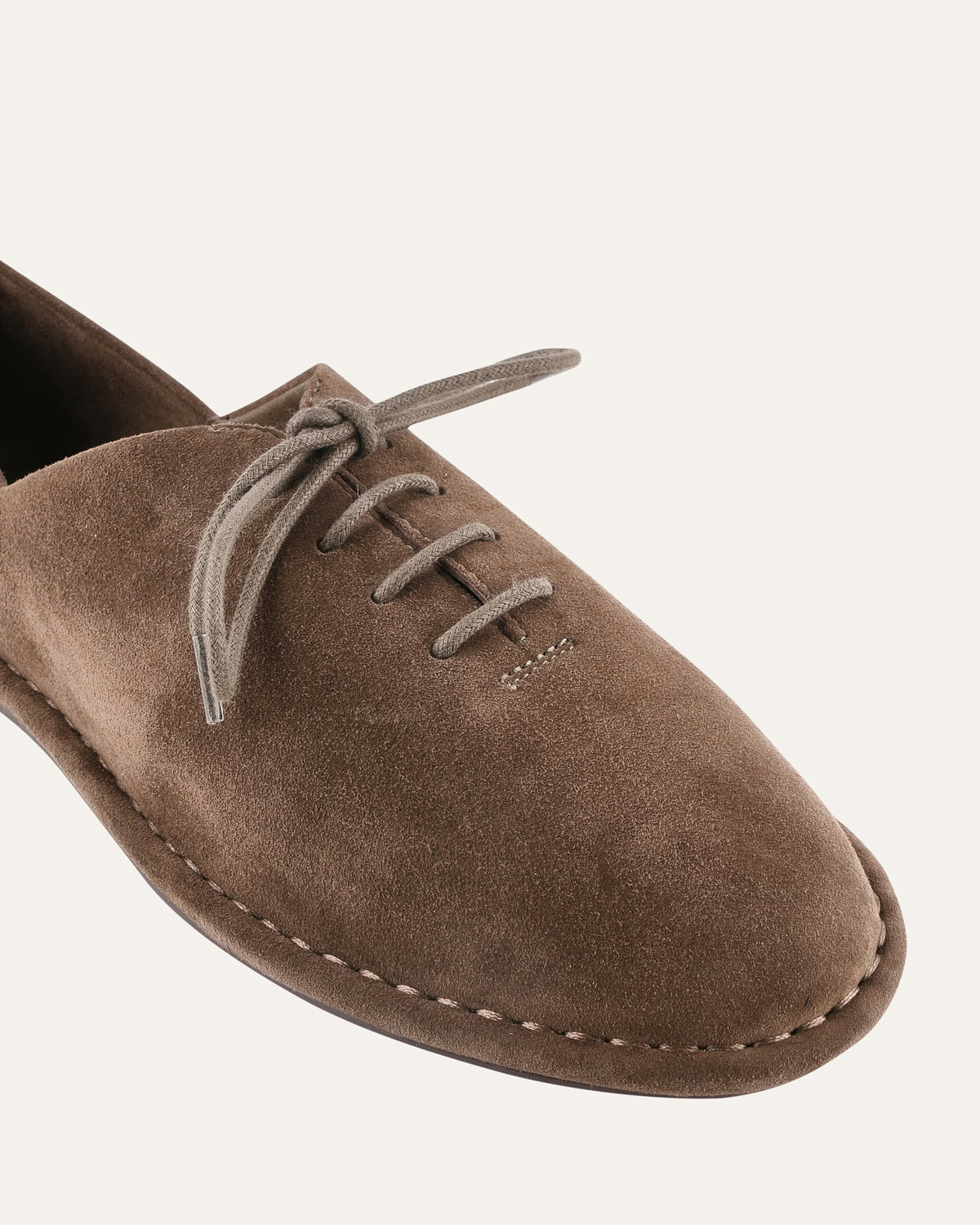 Brown suede loafer shoe on a white background