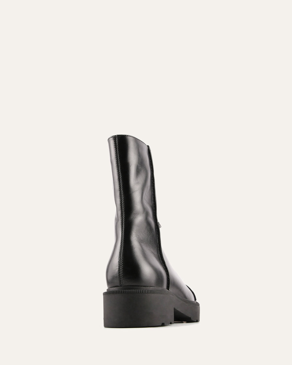Black leather boot on a white background