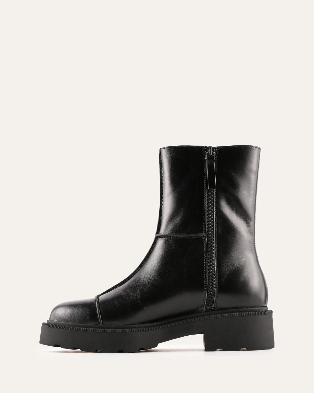 Black leather boot with a platform sole on a white background