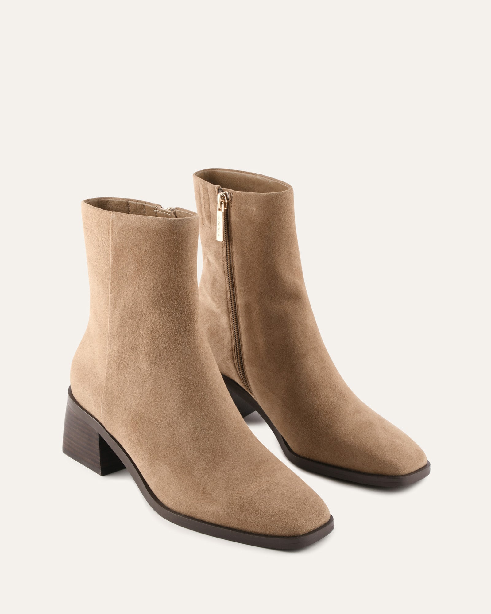 Tan ankle boot on a white background