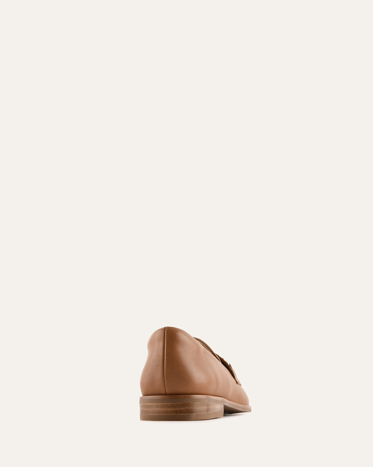 Brown leather shoe on a white background