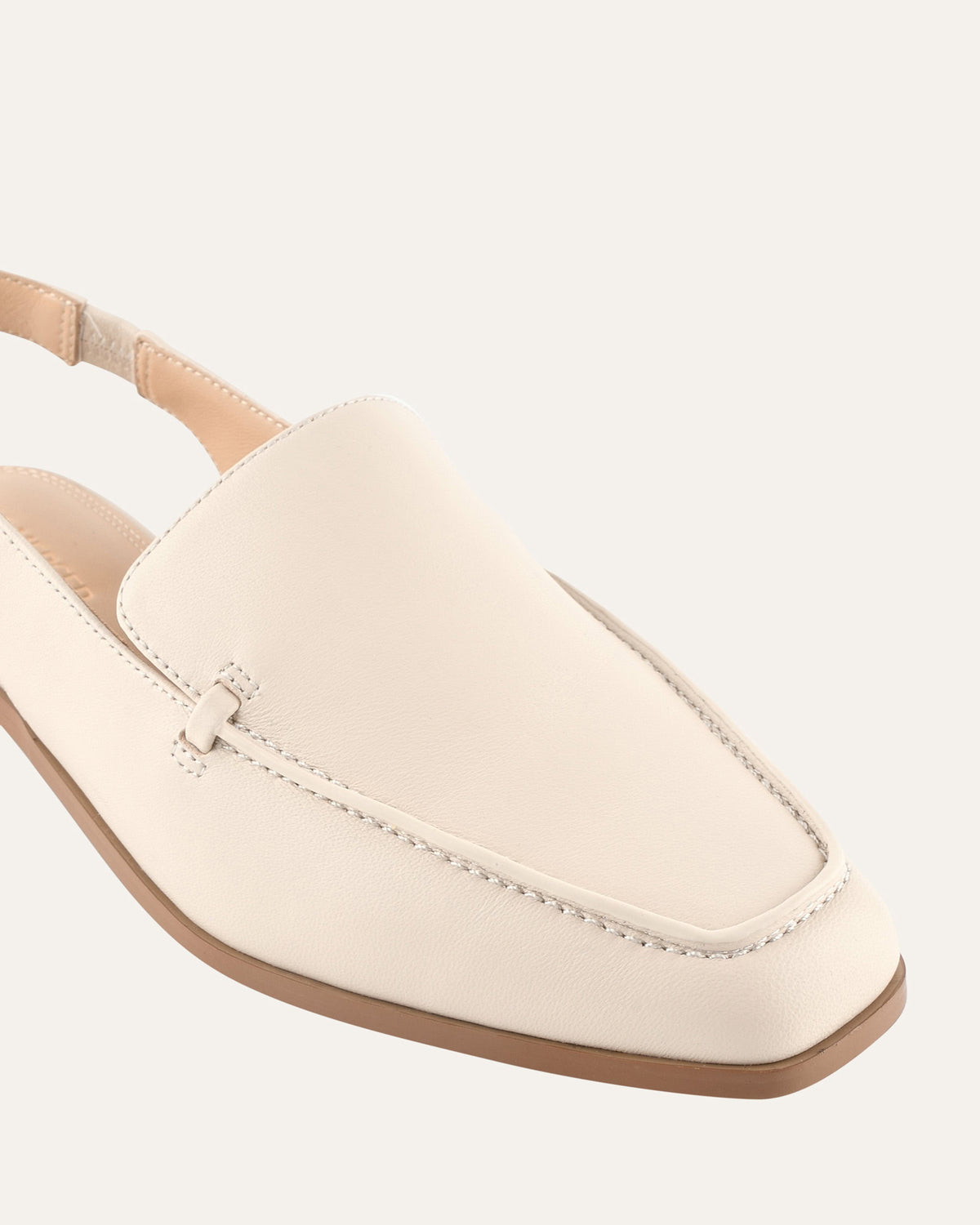 Beige loafer shoe on a white background