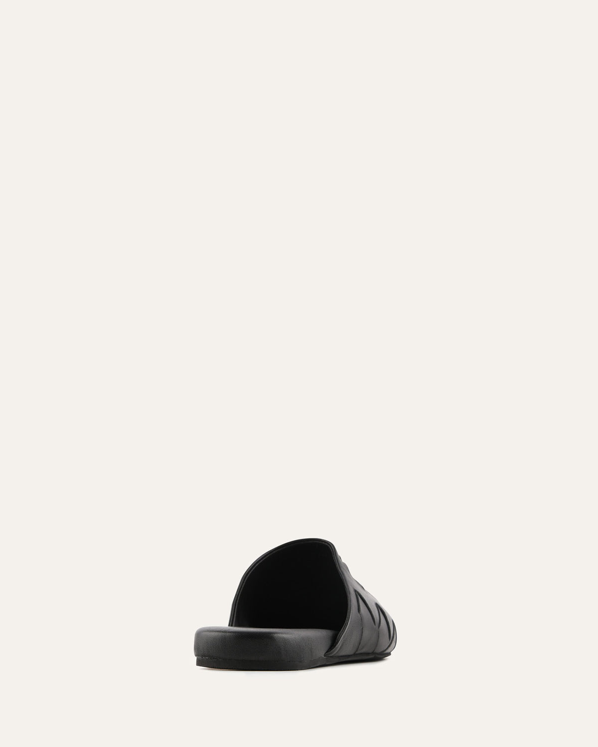 Black slide sandal on a light gray background
