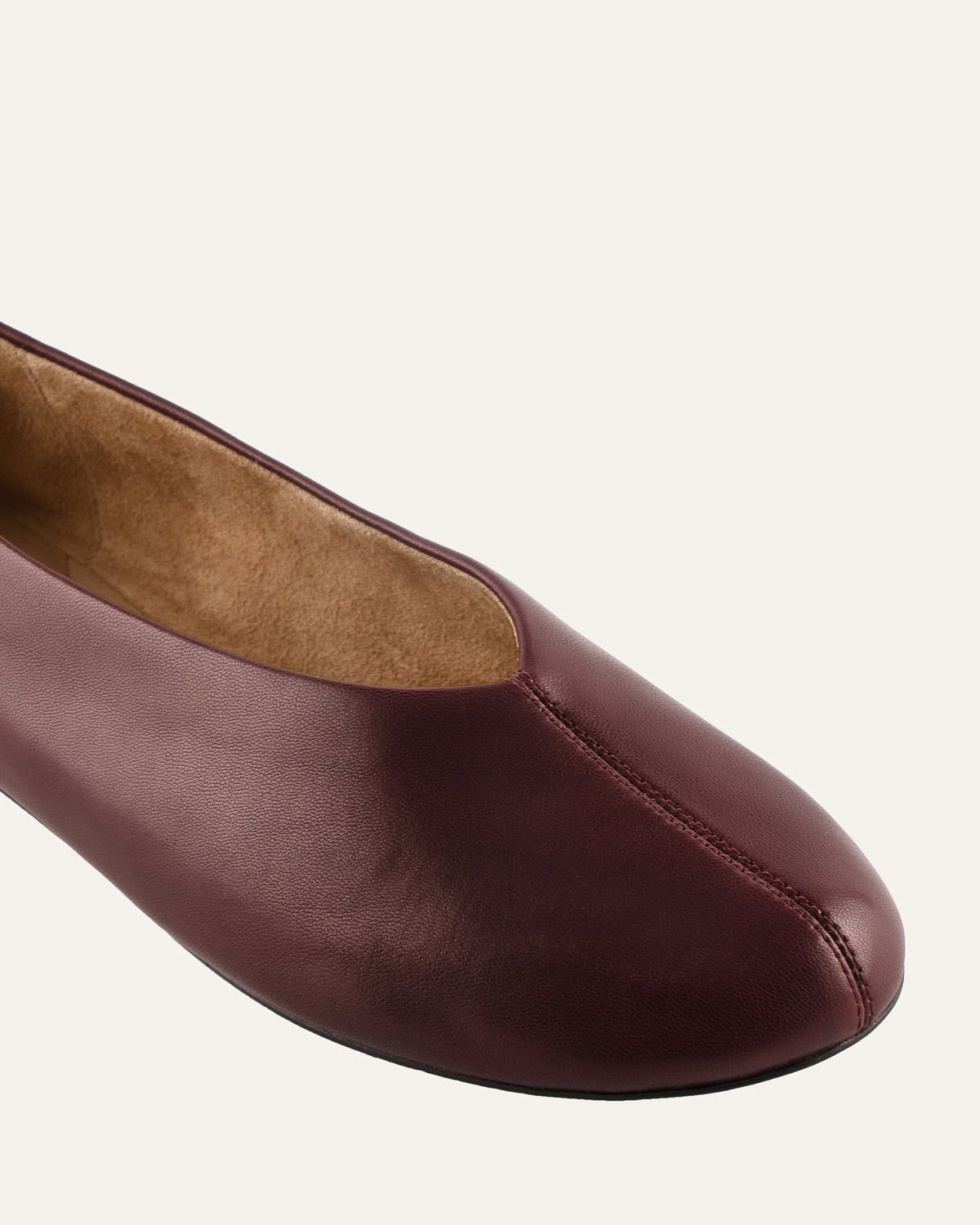 Brown leather shoe on a white background