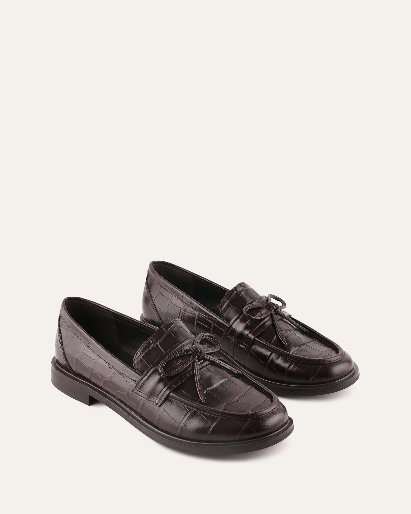 Brown leather loafer shoe on a white background