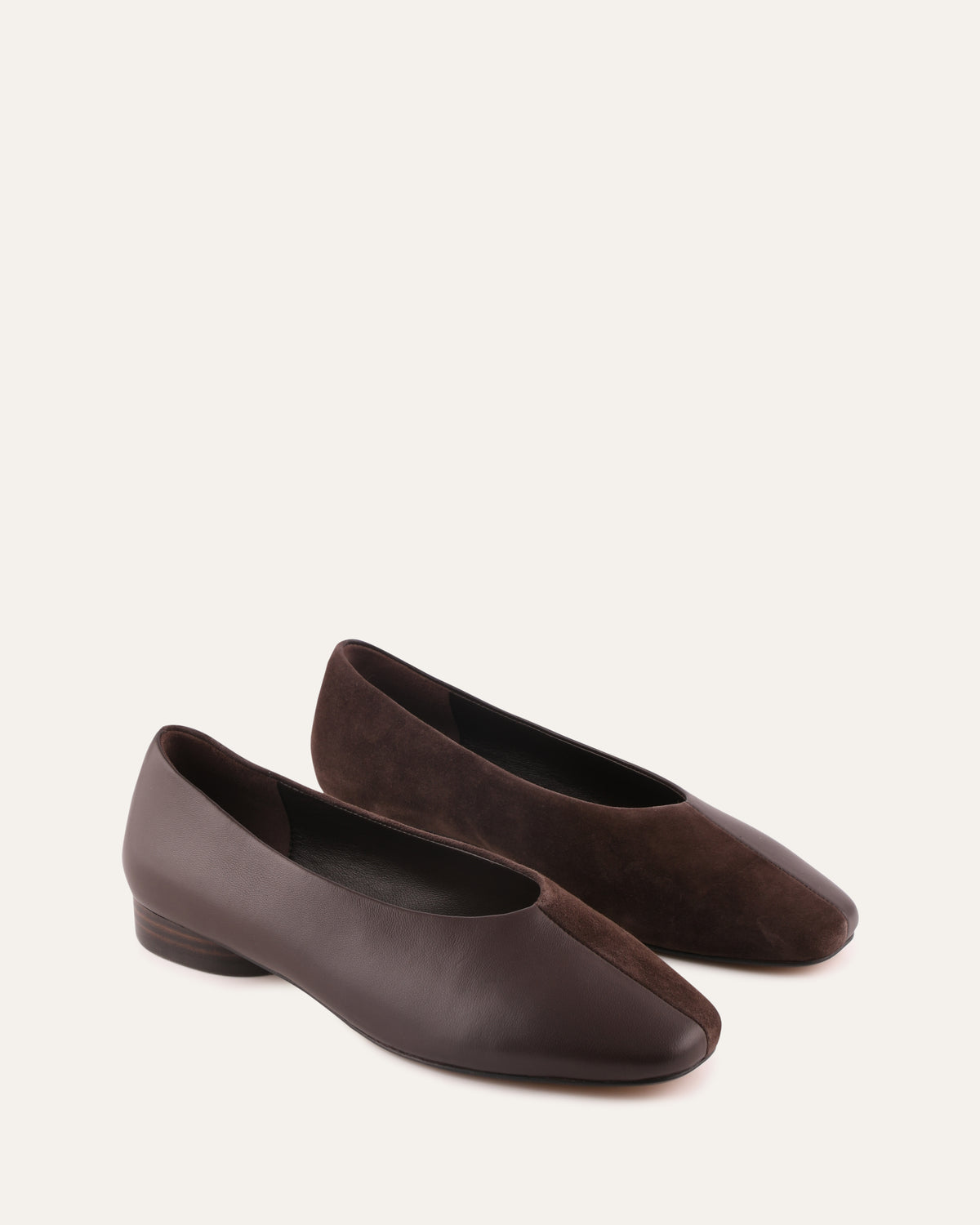 Pair of brown flat shoes on a white background