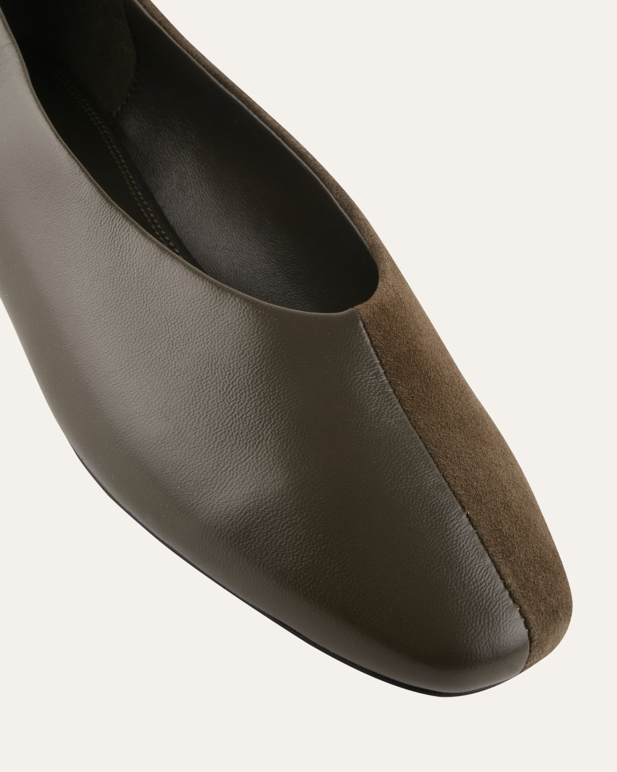 GREEN leather shoe with suede heel on a white background