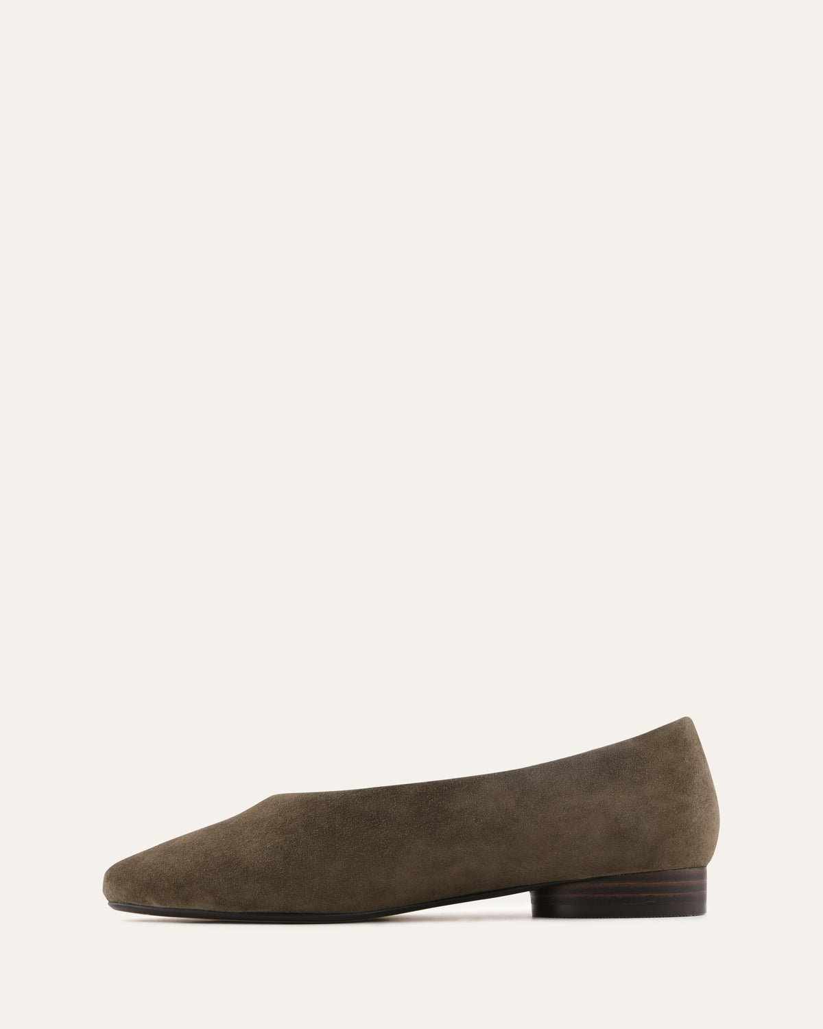 Brown suede flat shoe on a white background