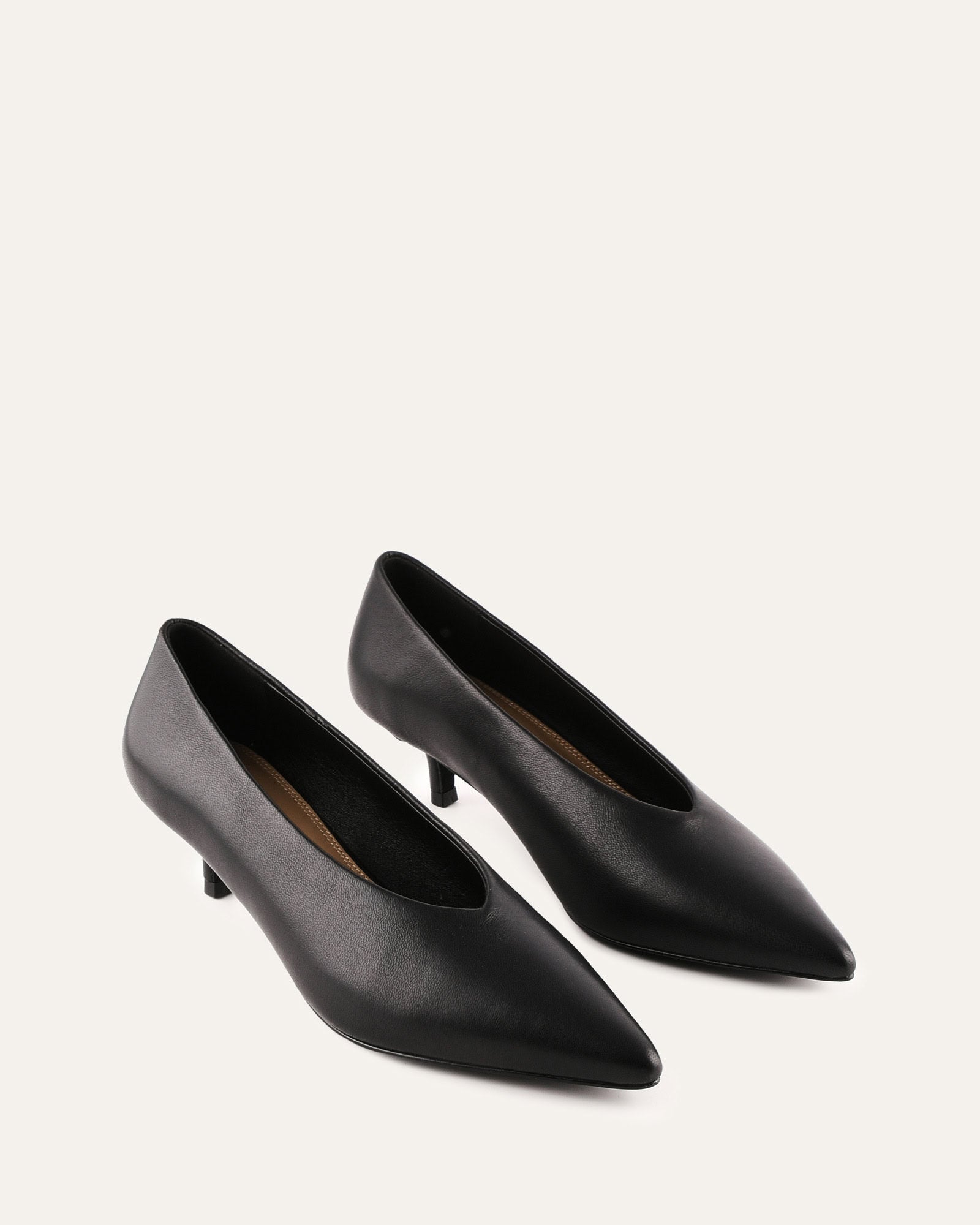 Black high heel shoe on a white background