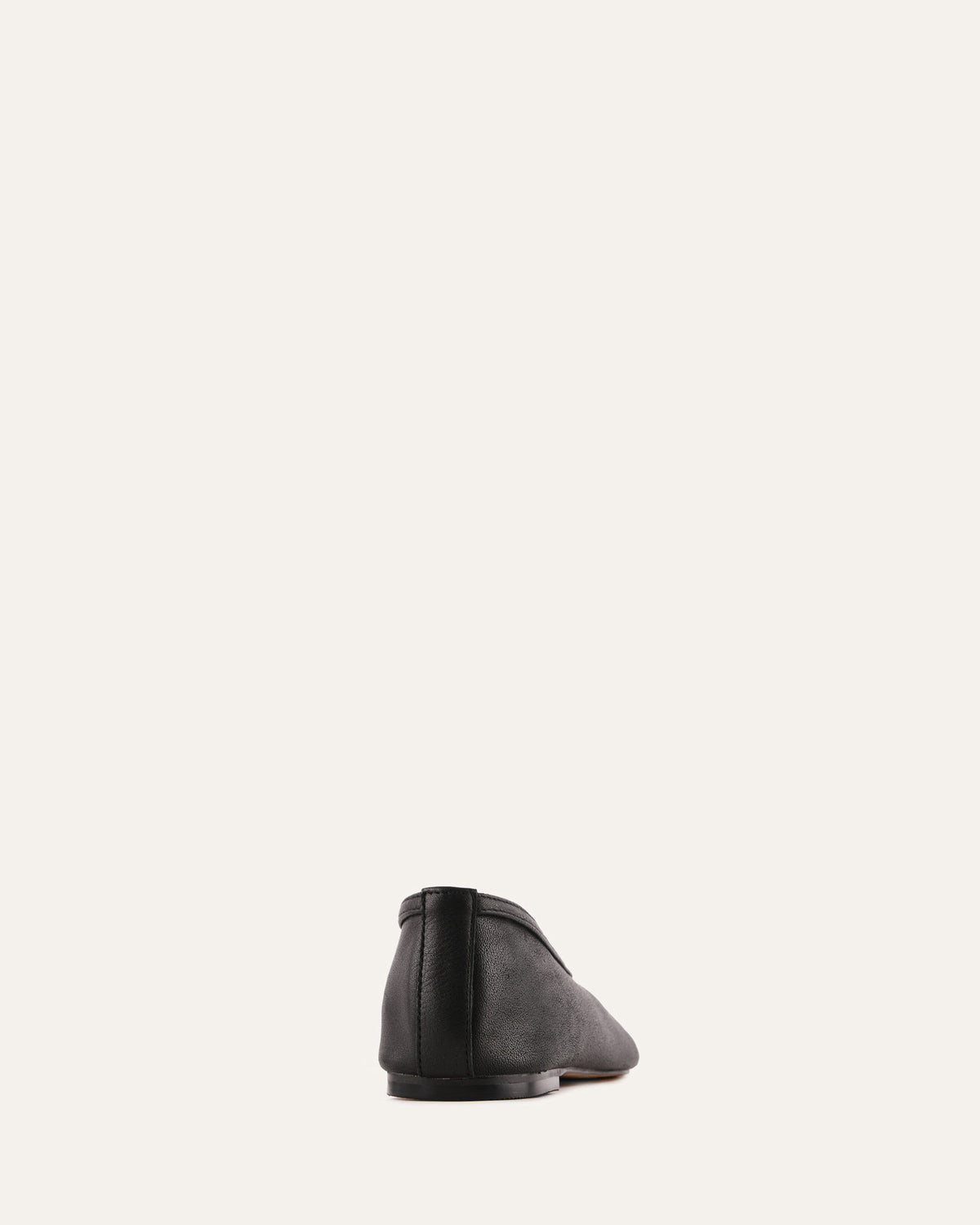 Black shoe on a light gray background